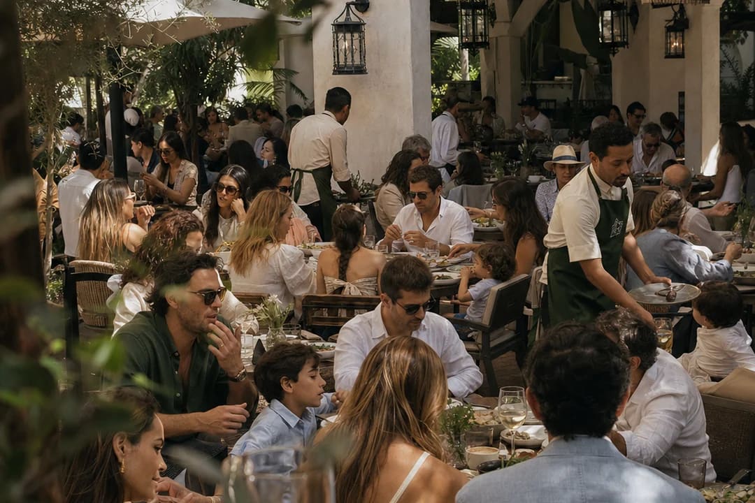 Conceptual view of the garden restaurant, with shared tables and greenery.